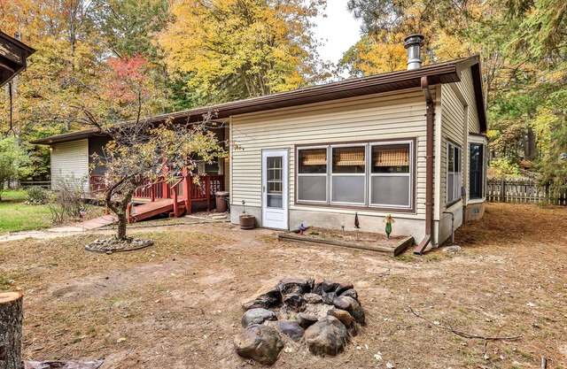 Lakefront home with private dock, screened porch, woodstove, fast WiFi, & W/D