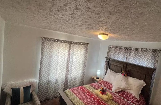 Large and neatly arranged house with a large parking lot .