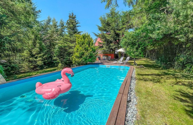 Large, practically furnished holiday home with 2 balconies and pool.