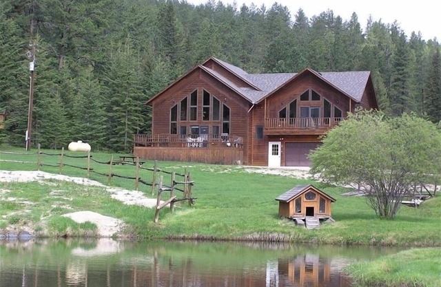 Large private lot. Beautiful cabin with a stream and trout pond!