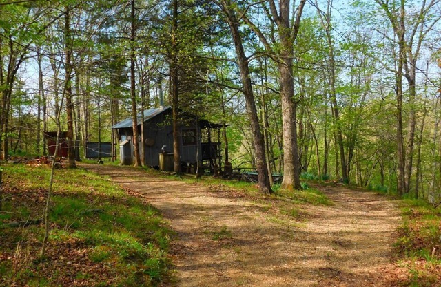 Line Camp Cabin is Secluded in The Woods Near The River.