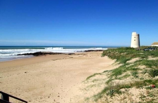 Log cabin next to the most beautiful beach.