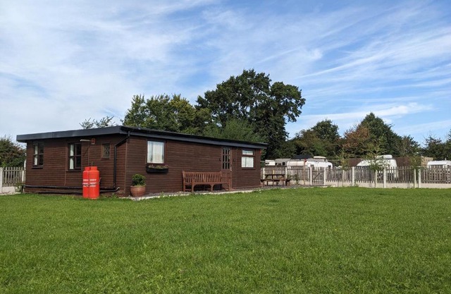 Log cabin with secure garden