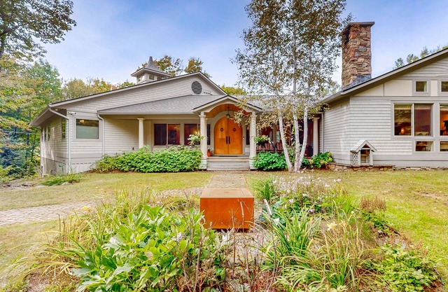 Luxe custom home with hot tub, game room, & beautiful garden