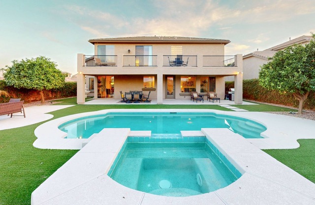 Luxe snowbird-friendly haven with heated pool, gas fireplace, balcony, & firepit