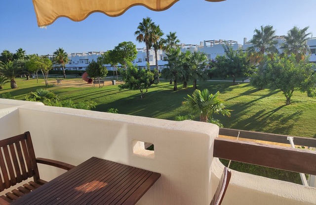 Luxurious apartament in golf resort with roof solarium, pool & garden.