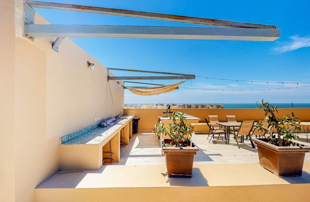 Luxurious mountain-view apartment close to the sea with rooftop sunset views