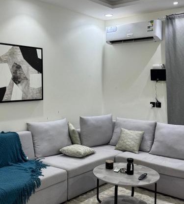 Luxury hotel suite with one bedroom and a living room