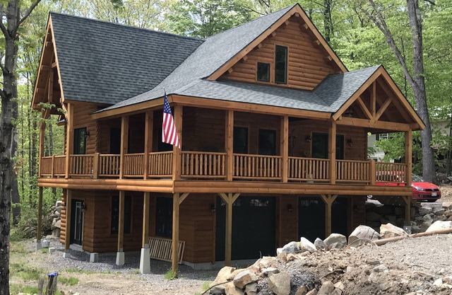 Luxury Log home steps from private beach in Meredith on Lake Winnipesaukee.