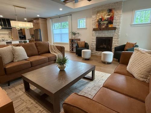Luxury New Construction with fireplace, office, and covered deck