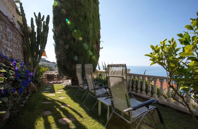 Luxury villa apartment with panoramic sea views and small private garden