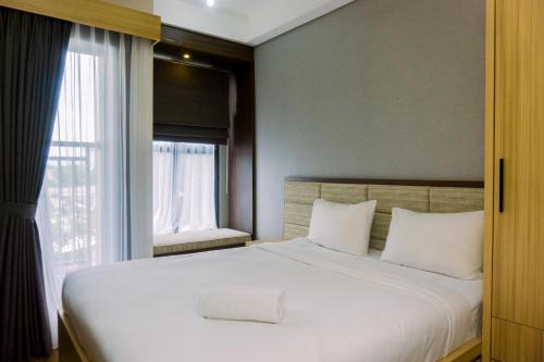 Minimalist and Warm Studio at Transpark Bintaro Apartment By Travelio