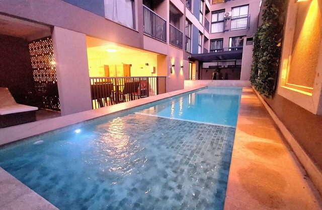 Modern apartment with its own small backyard and swimming pool