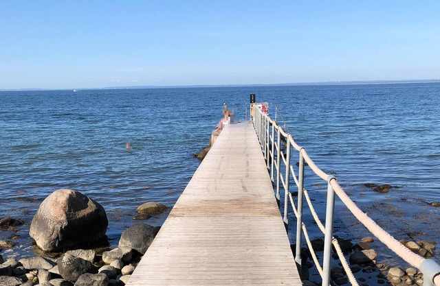 Modern and comfortable vacation apartment with shared outdoor pool, in the summery town of Båstad.