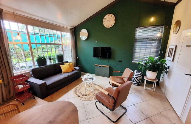 Modern country-style bungalow with hot tub. Pets allowed.