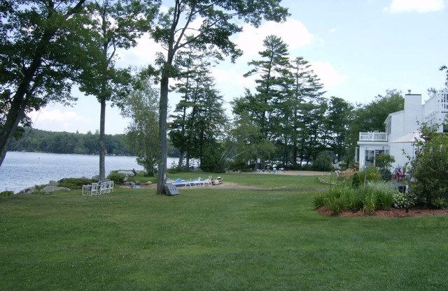 Modern lakefront home on Lake Waukewan with spectacular fall folliage views!