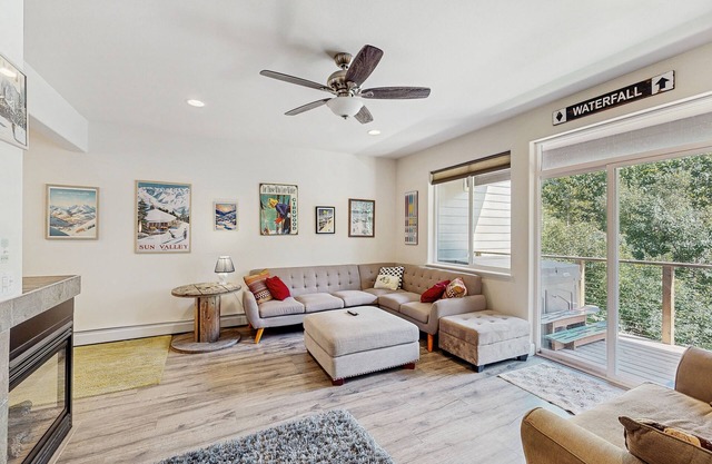 Modern riverfront condo with hot tub, entertainment & river views