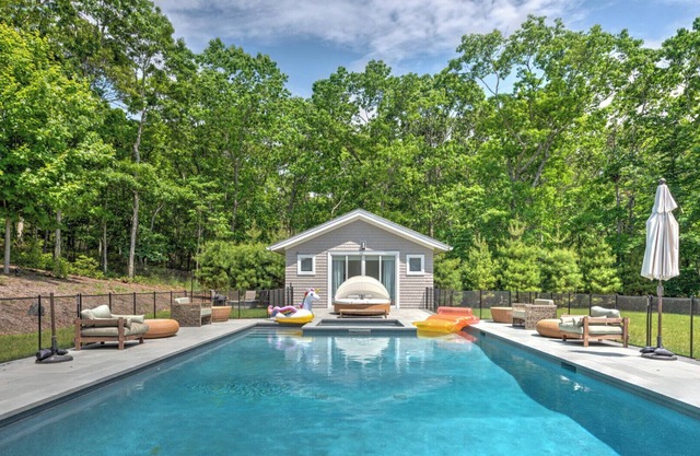 Modern-style home with heated private pool, open-floor plan, ample natural.