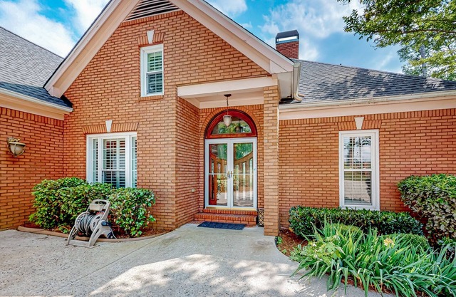 Multi-level home with an in-home theater, fireplace, & enclosed yard - dogs ok