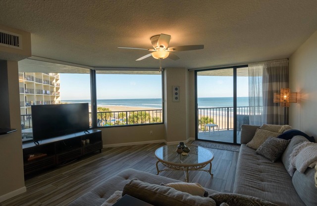 Multiple balconies in spacious oceanfront beach Condo