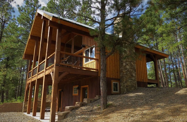 Nestled-in-pines, sooth-your-soul custom home with an incredible mountain view.
