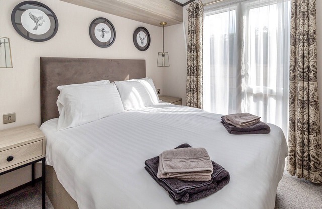 New in 2022. Lodge with two bedrooms, one double with en-suite and one twin and a shower room.