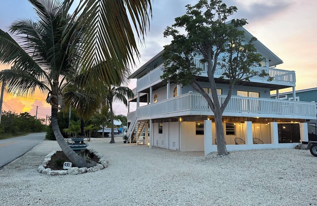 New pool & Huge master suite! Open water views , 2 stories of wrap around decks