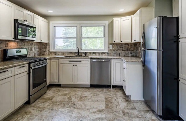 Newly Renovated 4 bedroom home W/big yard and driveway