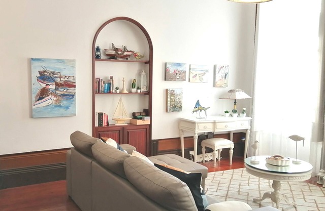 Next to the Douro river, near the beach and the historic centers.