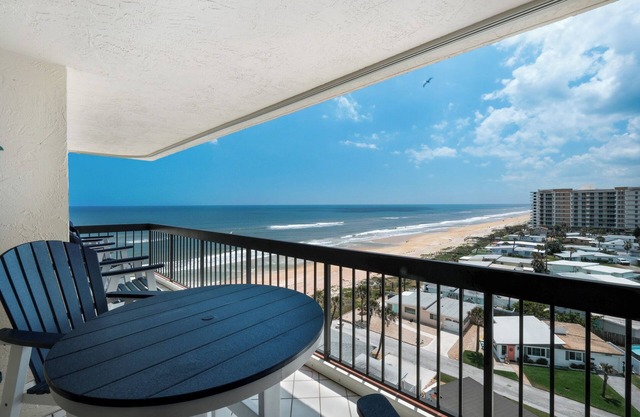 Oceanfront condo with large private balcony, heated beachfront pool and garage parking