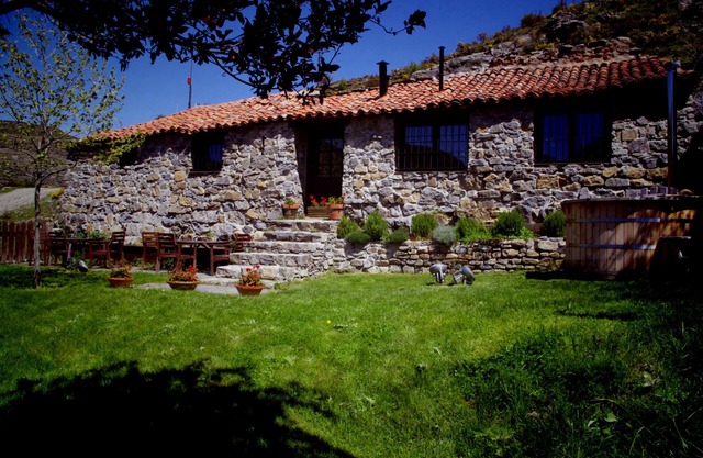 Old house in the mountain made of stone, rock and wood. Private garden and barbecue