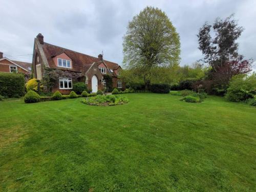 Old school house surrounded by countryside