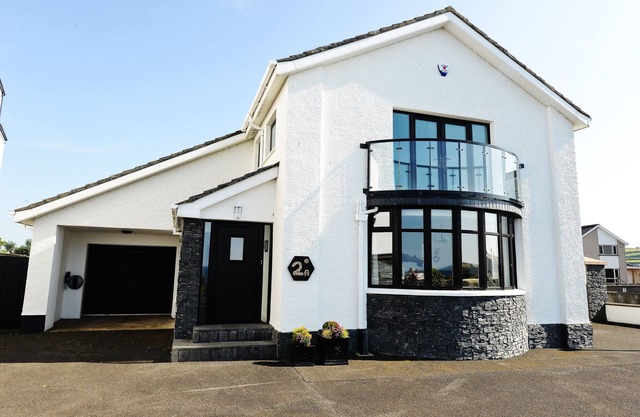 Outstanding location, sea views, spacious detached house with private garden