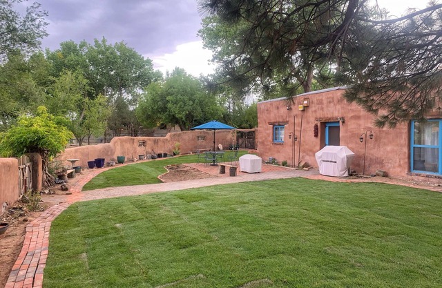Peaceful artisan adobe with view of the Sandias