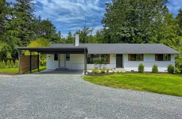 Private, beautifully updated rambler on 1/2 acre