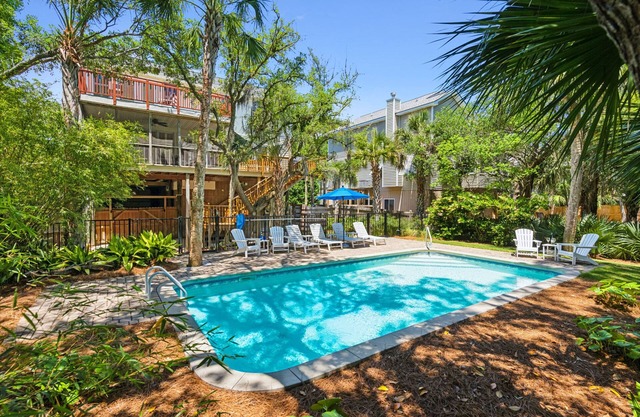 Private Oasis with a Large Saltwater Pool Close to Everything - Screened Porch and Deck Open Concept
