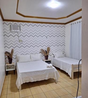 Quarto triplo com banheiro em Pousada e Restaurante