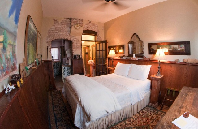 Quiet room in historic hotel, with queen bed, attached bath and kitchenette.