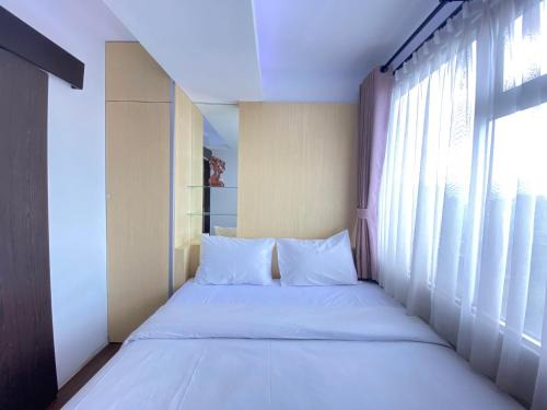 Quite 2BR Apartment AC in Living Room at The Jarrdin Cihampelas By Travelio