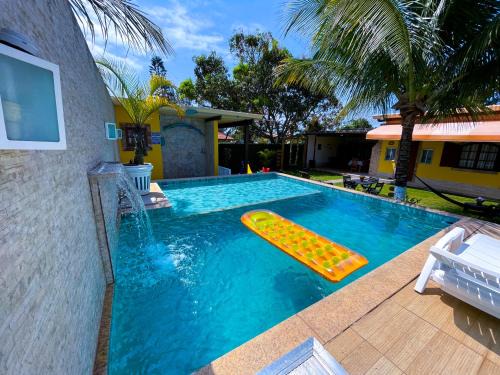 Recantos Pinheiros - Casa inteira, até 15 hóspedes - Piscina privativa, sinuca, ar condicionado e TVs nos 4 quartos - Condomínio Orla 500, lado praia - Unamar, Cabo Frio-RJ