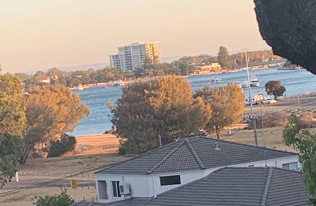 Recently renovated couples Retreat. Water views. Huge deck with tree in middle.