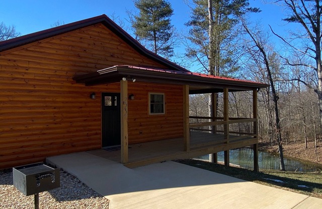 Relax in our secluded hot tub overlooking the pond with a glass of wine