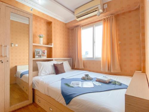Relaxing 2BR with Pool View Mutiara Bekasi Apartment By Travelio