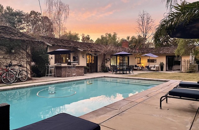 Resort style single level contemporary home with pool