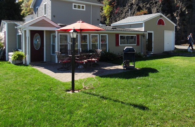 Romantic home on level Seneca Lake Front.