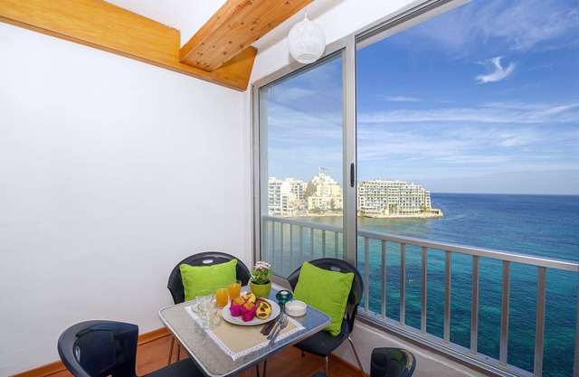 Seafront apartment enjoying spectacular views of Spinola and Balluta Bay.