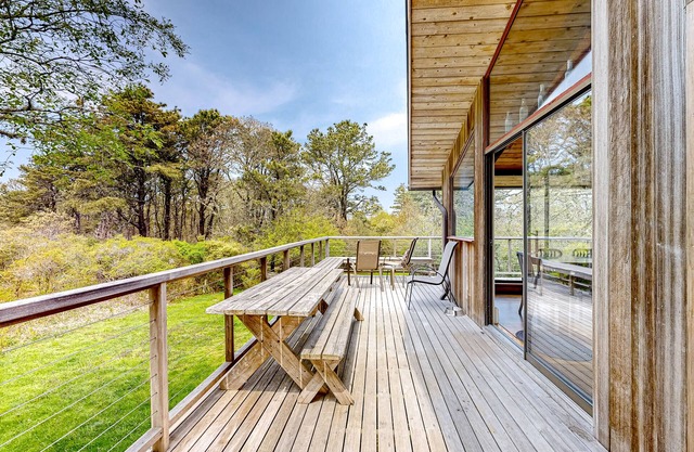 Secluded mid-century home with wraparound deck, yard, grill, partial AC, & W/D