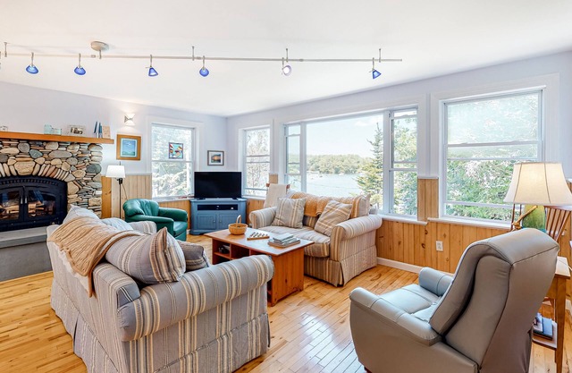 Secluded waterfront home with firepit, gas grill, kayaks, dock, balcony, & patio