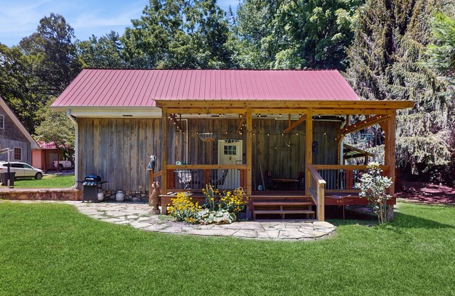 Serene waterfront home with firepit, deck, & central AC
