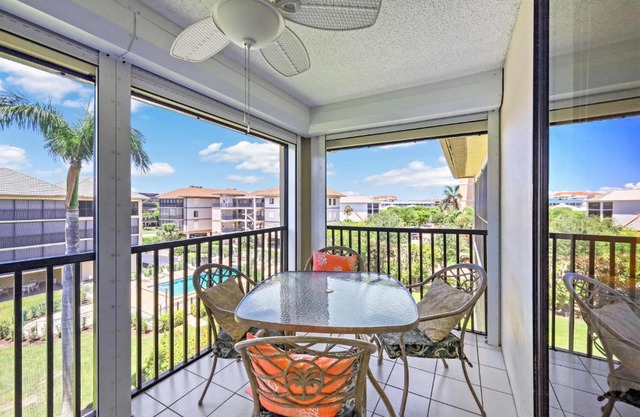 South end condo with pool/spa and steps to beach